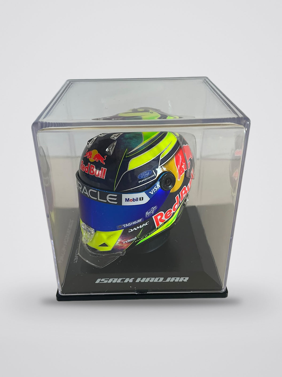 Isack Hadjar 2026 season mini helmet, 1:4 scale, left side in its display case, base marked Isack Hadjar