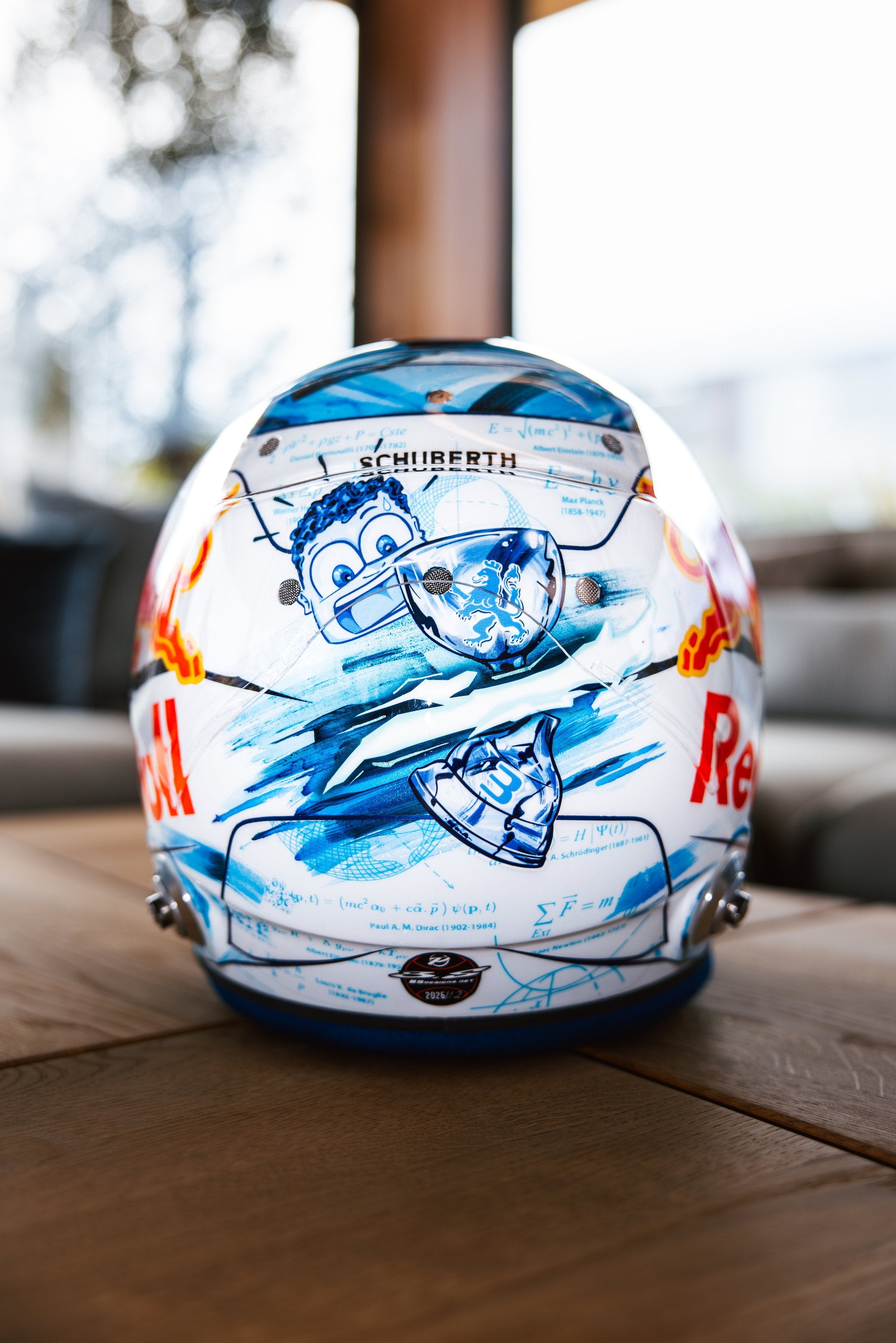 Front of the helmet, with the trophy and the cartoon